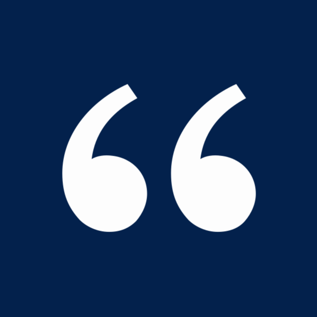 White quotes symbol on navy backdrop
